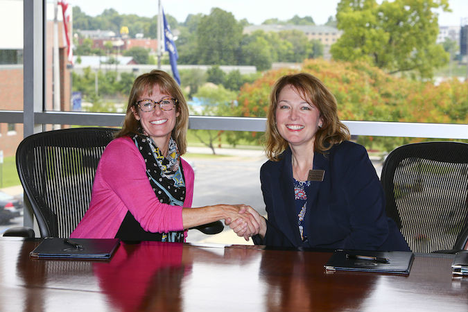 Drury University Provost Beth Harville and Ozarks Technical Community College Provost Tracy McGrady pen a transfer agreement between the two schools.