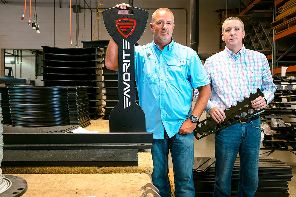 PARTNERS IN PRODUCTION: Brothers Mark, left, and Mike Miller run plastics manufacturer Polyfab, which their father started 45 years ago and now has clients globally.