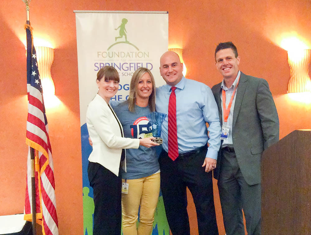 Cardinals for the Win
The Foundation for Springfield Public Schools selected the Springfield Cardinals as its Corporate Partner of the Year. Cardinals General Manager Dan Reiter, second from right, accepts the award from Natalie Murdock, the foundation’s executive director. Also pictured are Jeffries Elementary Principal Liz Cooper, second from left, and SPS Director of Elementary Learning Bret Range. The minor league club has covered the cost of transportation and tickets for 10,000 students for a day of learning and baseball.