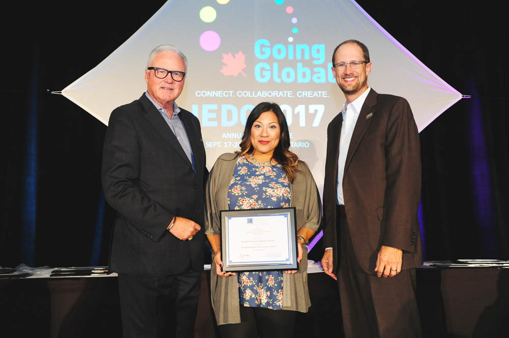 A for Attraction
Rachael Snow, Springfield Area Chamber of Commerce economic development marketing coordinator, center, and Ryan Mooney, senior vice president of economic development, far right, accept the International Economic Development Council’s Silver Excellence in Economic Development Award for the Talent Attraction Initiative. They are pictured Sept. 19 with IEDC Board Chairman Michael Langley at conference in Toronto.
