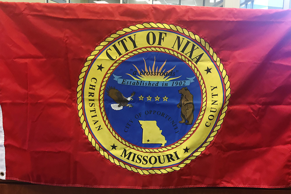 The old flag incorporates the former seal.