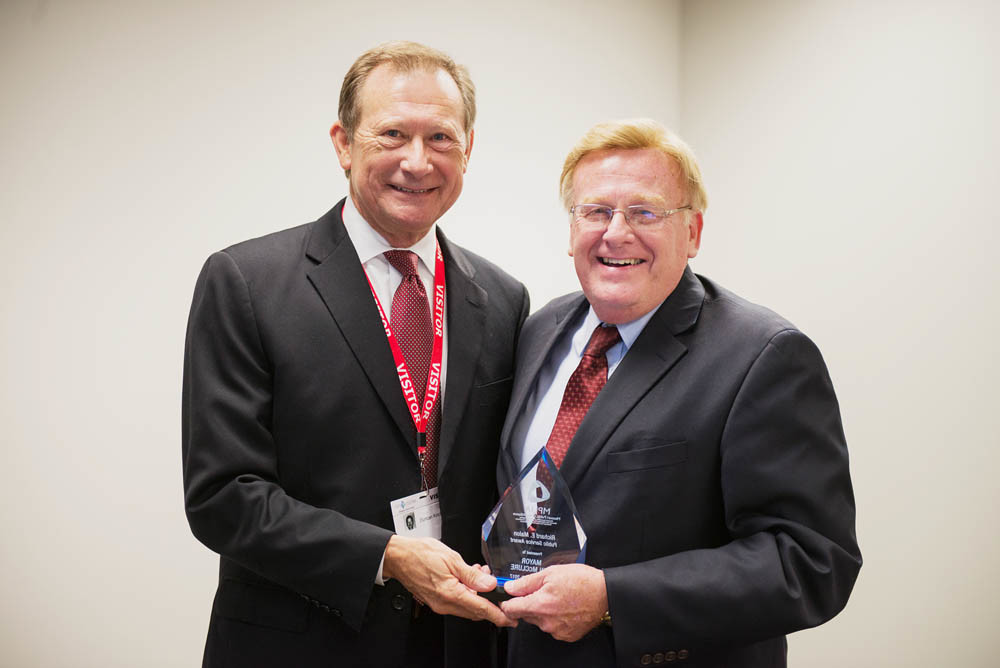 Powerful Leader
Missouri Public Utility Alliance President Duncan Kincheloe, left, hands Springfield Mayor Ken McClure the Richard E. Malon Public Service Award. It recognizes appointed officials who have furthered the objectives of municipal utilities.