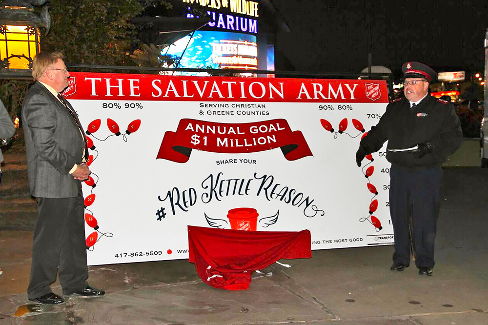 Mayor Ken McClure, Tree of Lights chairman, left, and Salvation Army Maj. Butch Frost unveil the nonprofit’s annual goal.