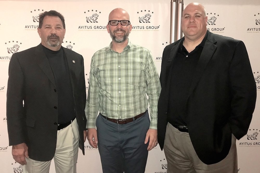 Layer 3 Technology CEO John Horton, left, and Vice President Ryan McCoy, right, join Avitus Technology Services President Kirk Porter.