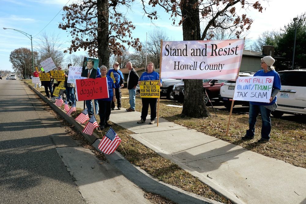 Tax reform opponents gather in front of Sen. Roy Blunt’s Springfield office.