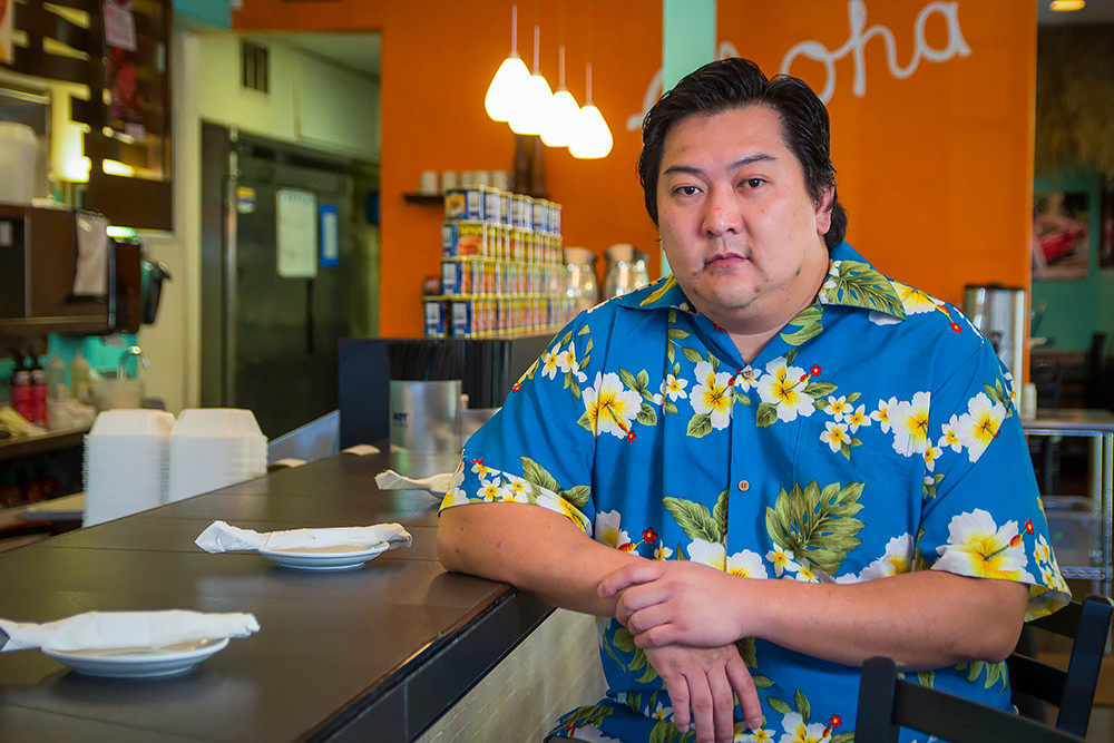 Johnson Tan, pictured, and his brother John Tan close The Big Island Grill.