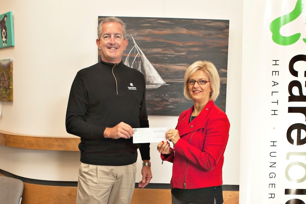 Raising Capacity
Central Bank of the Ozarks/Central Trust Co. President Russ Marquart, left, presents Care to Learn Executive Director Linda Ramey-Greiwe with a $10,000 check. The money will go toward Care to Learn’s Capacity Campaign, furthering efforts to serve children in southwest Missouri. The nonprofit currently works in 25 Missouri school districts.