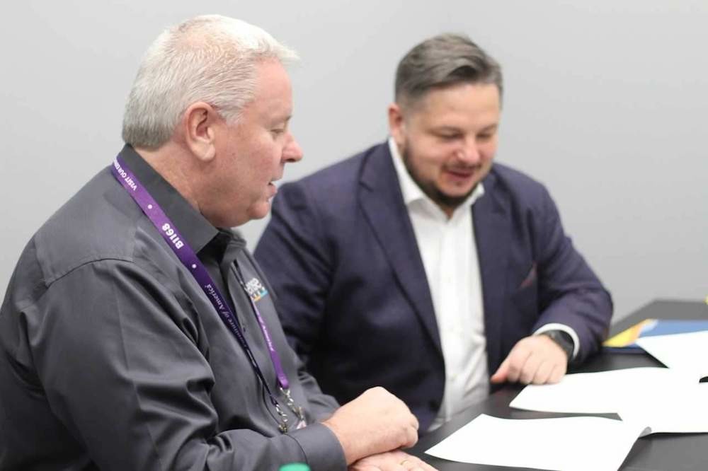 Advanced Sleep Technologies CEO Paul Longman, left, signs an iSense Sleep licensing contract with Askona CEO Roman Ershov.