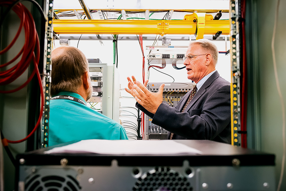 Mediacom’s Area Operations Director Steve Bennett provides a tour of the Springfield facility and processing center, holding $5,000,000 of the newest broadband equipment.