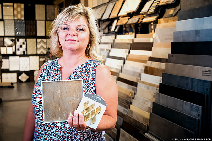 FINISHING TOUCHES: Unique Tile President Melissa Turpin shows off the intricate tile work her Nixa company is providing for the Museum of the Bible.