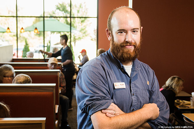 Kyle Johnson manages Traditional Bakery Inc.’s new Panera Bread on South Campbell Avenue.