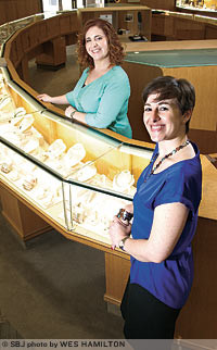 Margie Justice, right, and Amelia Justice, co-owners of Justice Jewelers, say they are diversifying the company's approach to advertising since the 2011 death of their father.