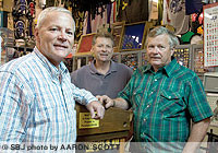 From left, brothers John, Mike and Rob Appleby co-own Surplus City with their retired father, Bob (not pictured). The Appleby family took over the store in 1962 and has since altered its products with the times and with other competitors entering the market.