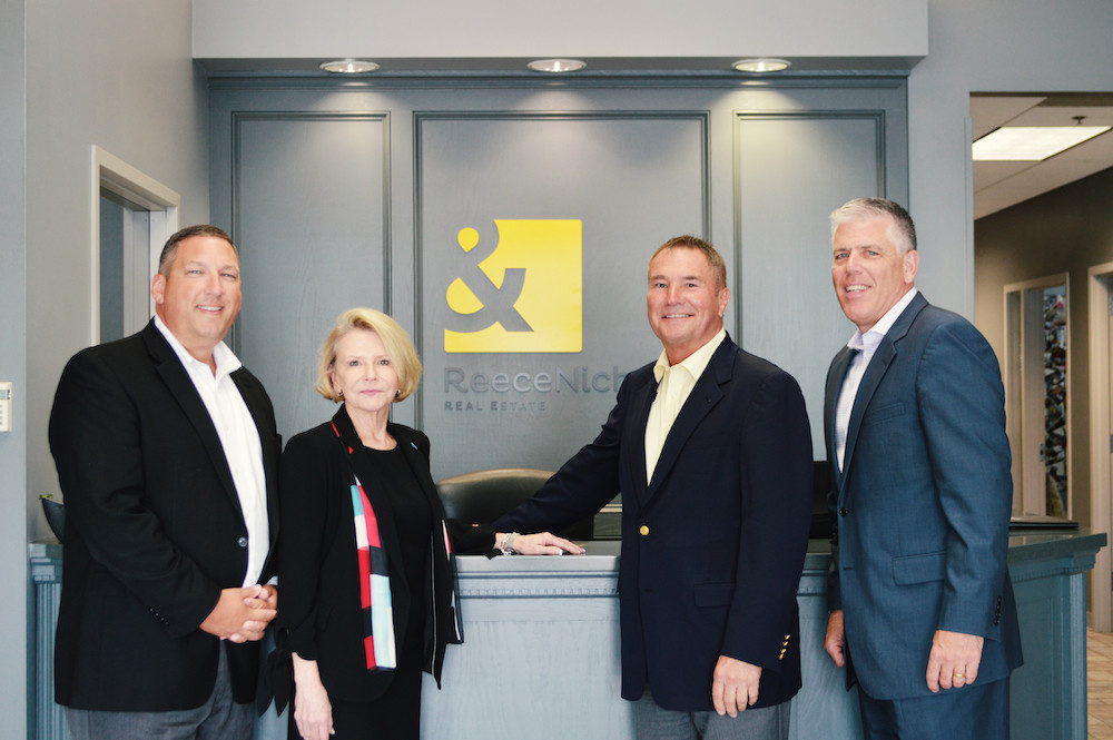 CJR CEO Shaun Duggins, left, is transitioning to president of ReeceNichols’ southern region. He’s pictured with Linda Vaughan, CEO of ReeceNichols, Rick Witeka, general manager of ReeceNichols’ southern region, and Mike Frazier, president and CFO of ReeceNichols.