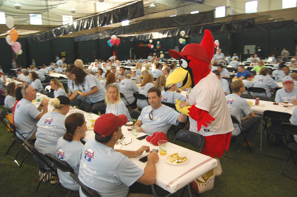 Community Strong
Two thousand volunteers from 126 businesses and organizations gave 12,000 hours of time completing projects for area nonprofit agencies and schools for United Way of the Ozarks’ Day of Caring on June 28. Springfield Cardinals’ Louie, above, greets volunteers at the kickoff breakfast. 