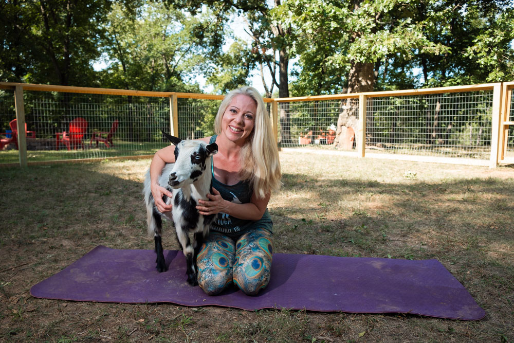 FARM FRIENDLY: With Don Draper by her side, Stephanie Wubbena instructs Goats and Yoga in Rogersville.