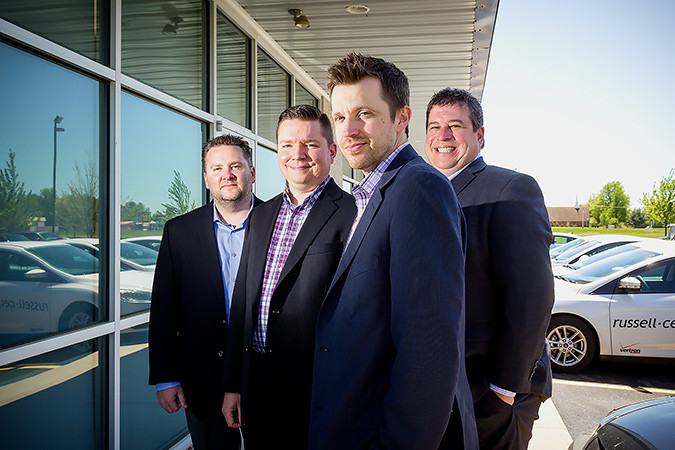 Russell Cellular executives Darin Wray, left, Nathan Mindeman, Jeff Russell and Robert Lister recently relocated into new corporate offices. SBJ photo by WES HAMILTON