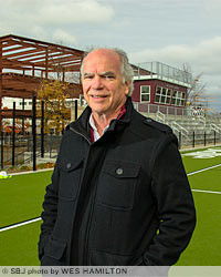 The O'Reilly Clinical Health Science Center takes shape behind Doug Sampson, the director of planning, design and construction at Missouri State University. The school was chosen as the 2014 Developer of the Year by the Salute to Design and Construction Council.