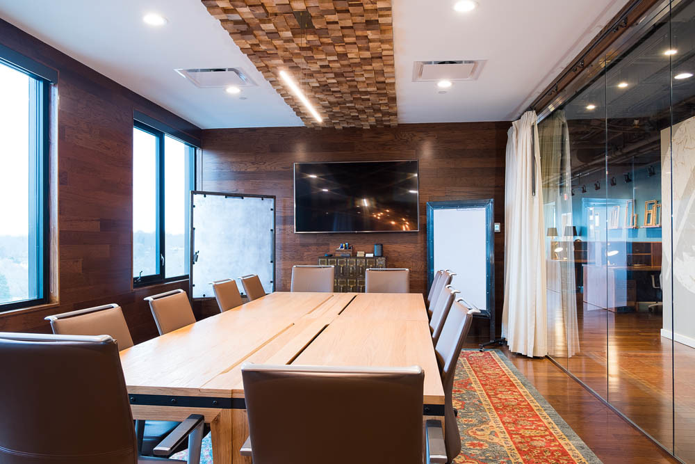 Behind the Curtain
The fourth-floor conference room has a sleeker feel than its downstairs counterpart with dark, rich wood coloring complemented by a wooden texture ceiling runner.