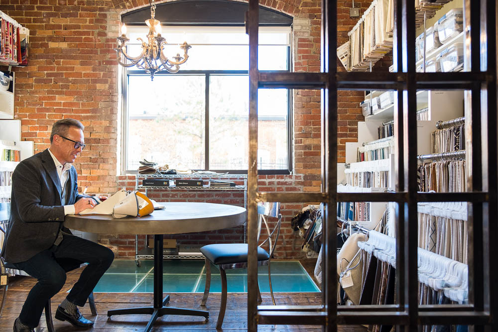 Inspiration Nook
Co-owner Nathan Taylor uses this room layered with fabric swatches to consult with clients on interior design. He says his collected style means many items found throughout the office have a story or history behind them.