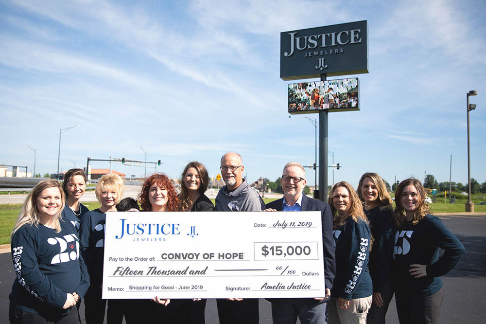 Hope & Justice
Convoy of Hope and Justice Jewelers representatives July 11 celebrate the $15,000 raised by the jewelry store during a June campaign in which 10% of sales went to the disaster relief nonprofit. Justice Jewelers staff members wore Convoy of Hope shirts throughout the month to promote awareness about the fundraiser. Officials say Convoy’s disaster services team has responded to 15 disasters this year.