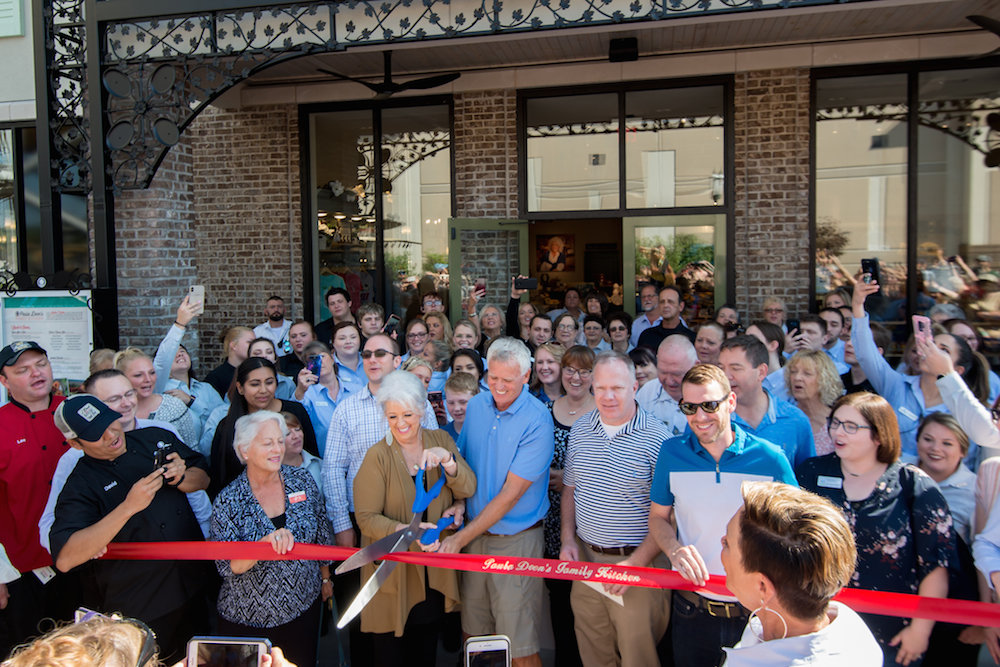 Paula Deen cuts the ribbon on Monday for a new Branson restaurant bearing her name.