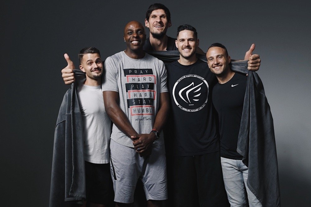 Boban Marjanovic, center, poses with new business partners, from left, Josh Stewart, Anthony Tolliver, Dane Watts and Bryan Simpson.