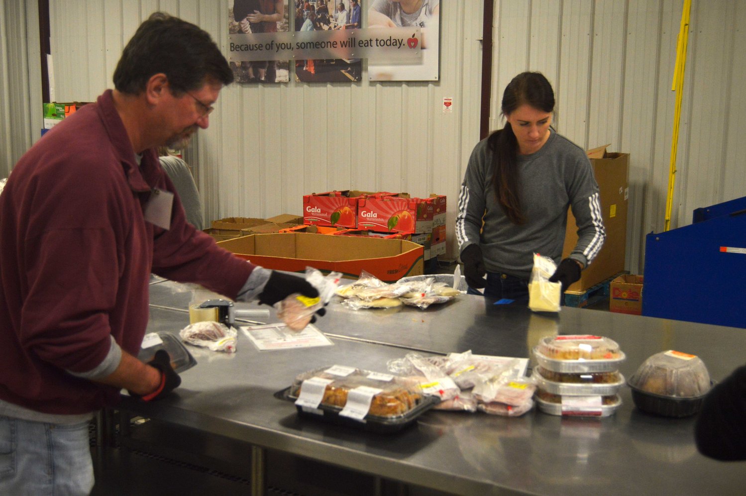 Temporary workers prepare food at Ozarks Food Harvest.