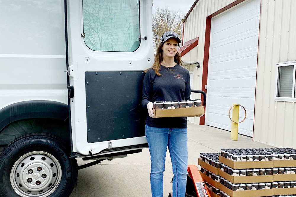 CAN DO ATTITUDE: Jessica Ollis of Spring Branch Kombucha loads up the company van for the first delivery of canned products.
