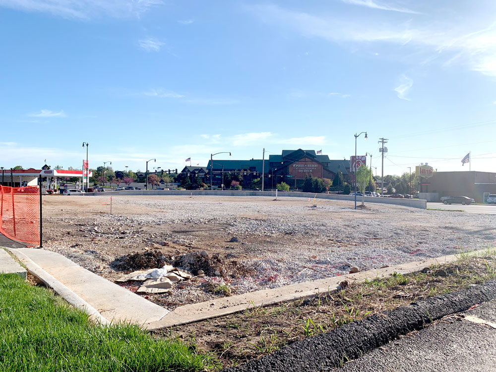 The lot where Raising Cane's is expected to open this summer sits empty April 21.