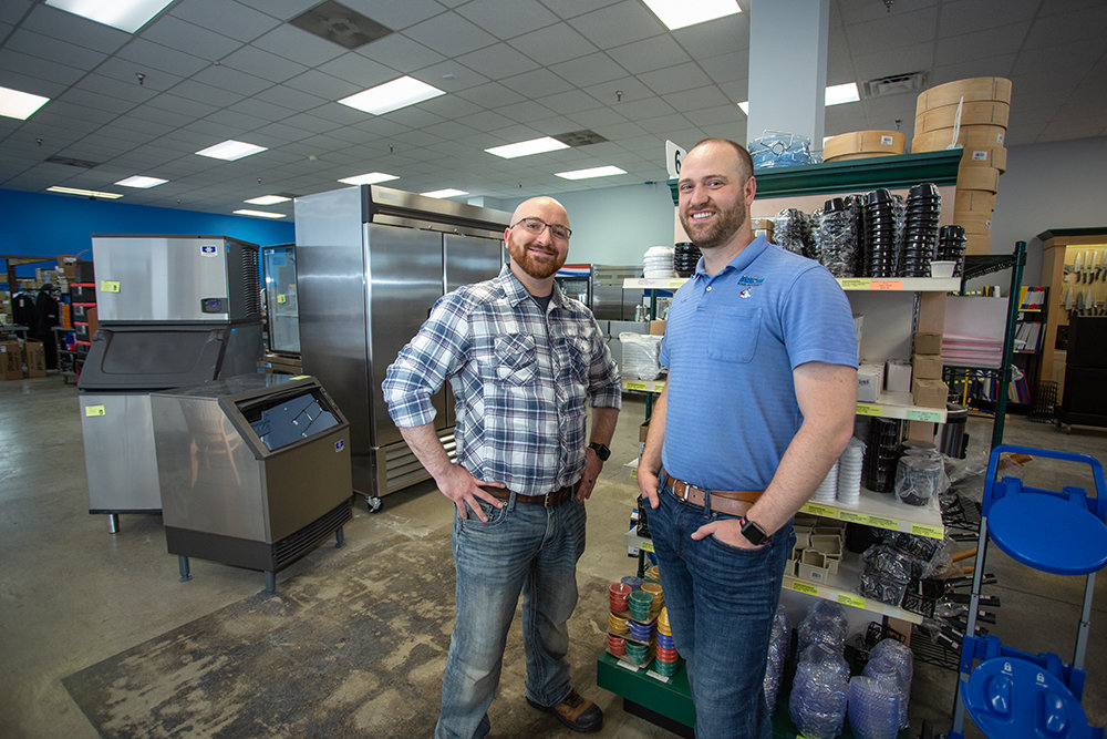 ARCTIC ADDITION: Jason Paulsell, left, joins Arctic Food Equipment Manager Nathan McCartney as the company's first parts manager.