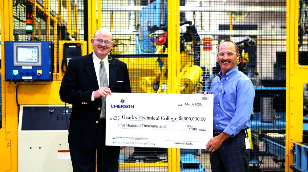 GIFT NO. 1
Ozarks Technical Community College Chancellor Hal Higdon, far left, accepts a ceremonial check from Emerson Electric Co. (NYSE: EMR) Operations Director Keith Calhoun. The St. Louis-based international manufacturer has pledged $500,000 – the first gift in a $10 million capital campaign for OTC’s $40 million Center for Advanced Manufacturing. Officials say the planned campus building will house the Emerson Innovation Discovery Lab.