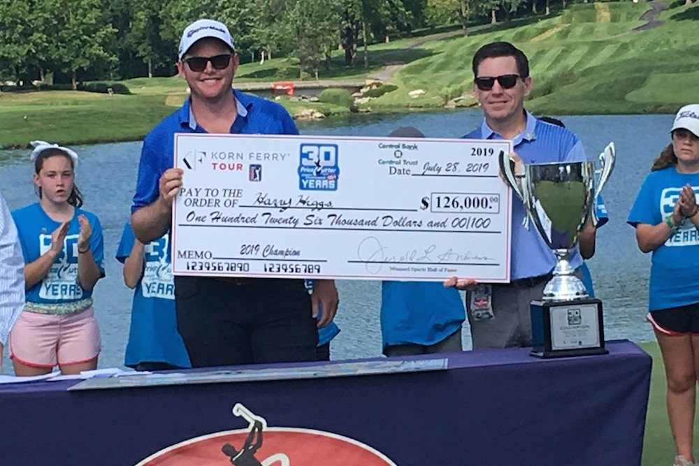 Price Cutter's Rob Marsh, right, presents a $126,000 check to last year's Price Cutter Charity Championship winner Harry Higgs.