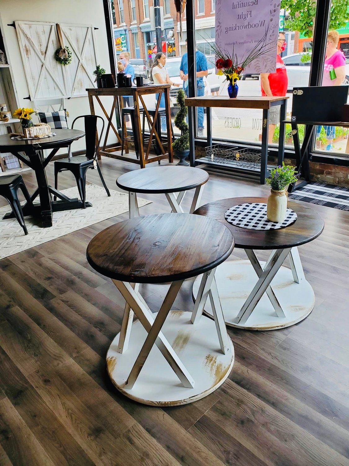 The shop focuses on custom farmhouse-style furniture and home decor items, such as coffee tables, benches and shelving.