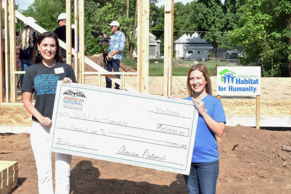 RAISE THE WALLRepresentatives of Habitat for Humanity of Springfield raise a wall during a July 10 ceremony to begin construction of the largest home built by the organization. It's a seven-bedroom, three-bathroom house in Woodland Heighs for the Wilmoth family of 10. To help fund the project, American National matched donations in Habitat's Beams of Hope campaign, so $20,026 is going toward construction costs. When complete, the Wilmoths will purchase the home with a 0% interest mortgage upon their completion of 350 sweat equity hours.