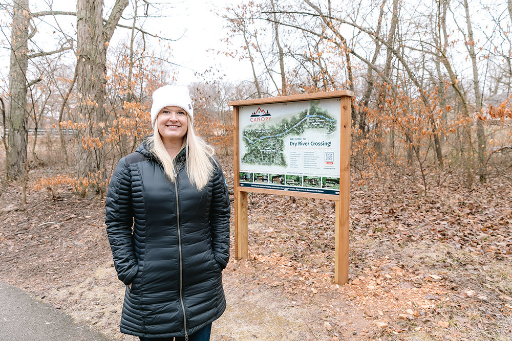 Ginnett Sturdefant of Sturdy Real Estate stands on the site of Canopy, where green-certified homes are slated to be built this spring.