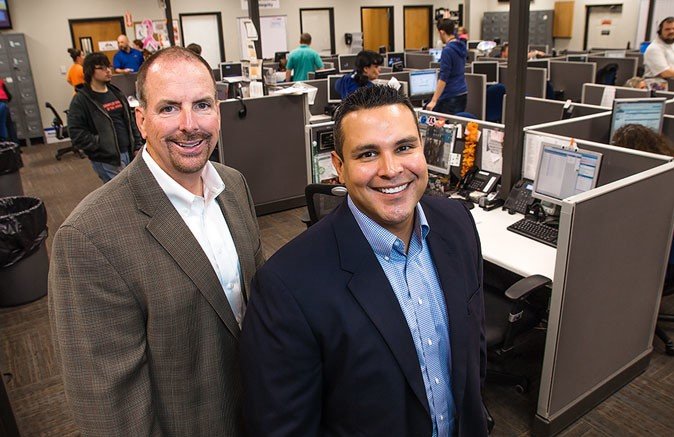 Gold Mountain Communications owner Hank Seevers, left, promotes Ian McGuire to chief operating officer.