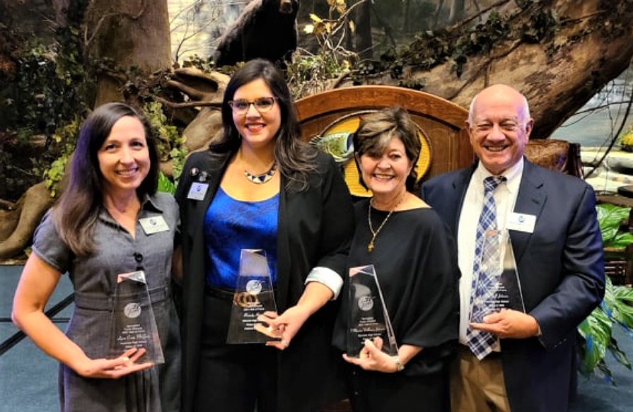 From left, Lynn Craig McGrew, Brandy Harris, Marcia Johnson and Dr. Jeff Johnson are honored at White River Conference Center.