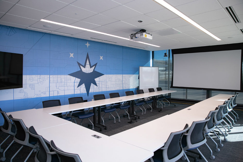 Adjacent to the main entry is the architecture firm’s largest conference room, which includes seating for over 20, video equipment, a retractable screen and an operable wall to easily shift between private and public meetings. Its main wall features a map of Springfield overlaid on the proposed redesign of the city’s flag.