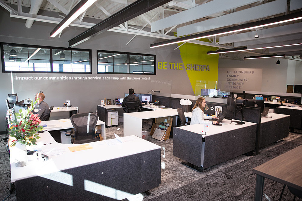 The studio space has open workstations and adjustable standing desks, while the firm’s vision and mission statements are both prominent on the back wall. “Be the Sherpa” is a principle Paragon follows to see projects through its clients’ eyes and guide them through completion.