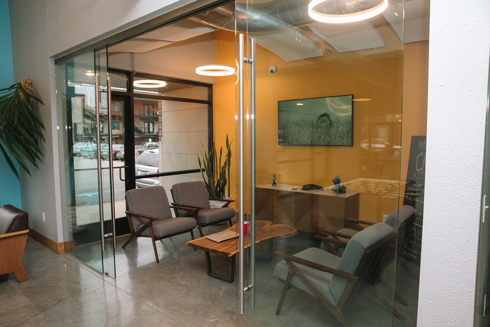 Two breakout meeting spaces have sliding glass doors to provide a more intimate setting for client meetings or internal collaboration.