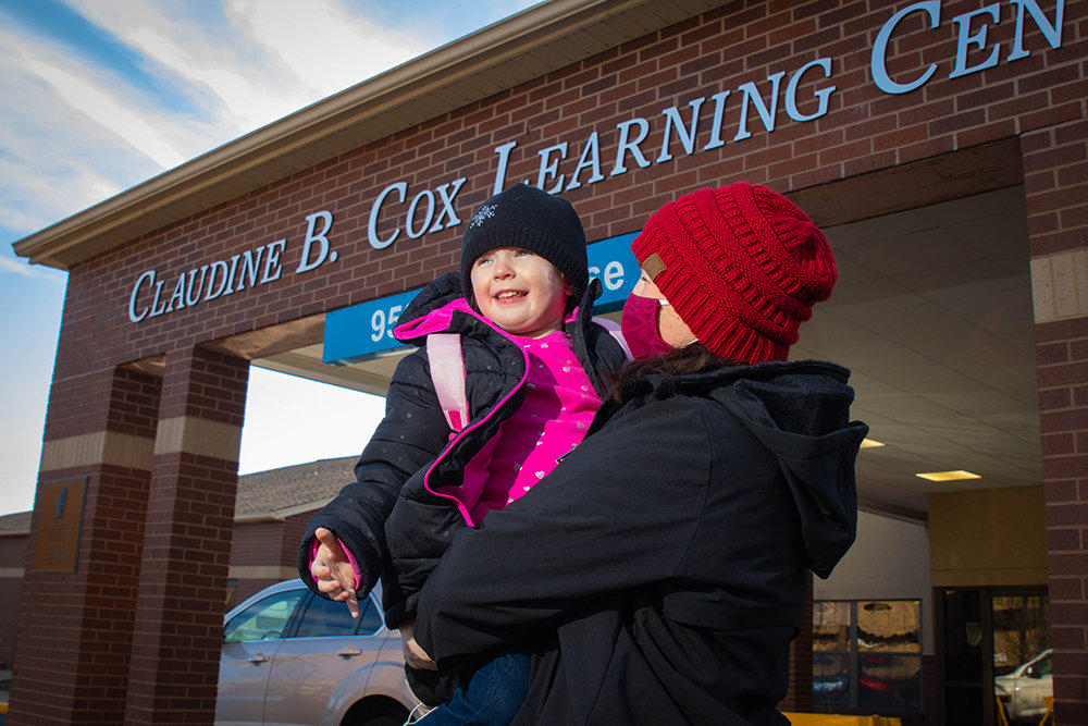 Cox Medical Center South employee Laurisa Lauderdale escourts her preschool-aged daughter, Reighlynn Stevens, to one of three learning centers operated by the center.