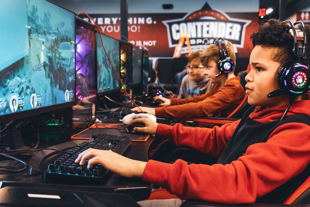Republic residents Brayden Day, 11, in front, and Jacob Burgin, 12, take advantage of spring break to play games at Contender eSports Springfield.