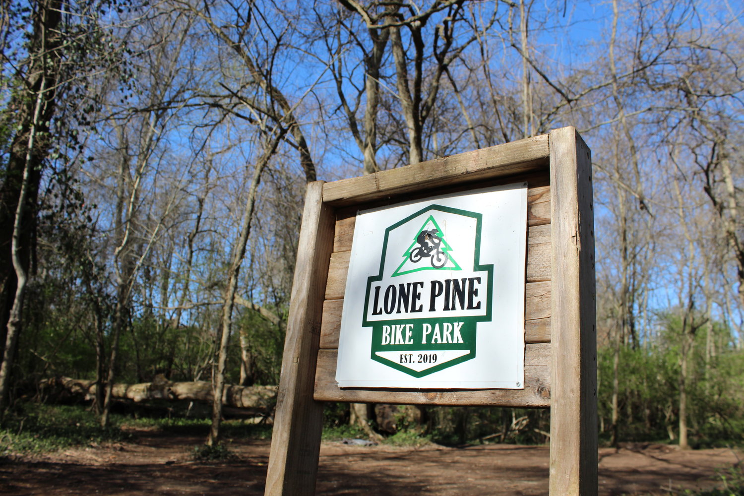 INTO THE WOODS: Lone Pine Bike Park, started in 2019 by teen residents, is in a wooded area between the Galloway Creek Greenway and South Lone Pine Avenue.