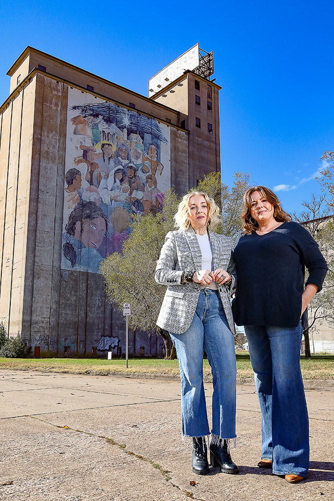 While it won't be utilized as part of their restaurant and retail project, sisters Sheri Perkins, left, and Renee Textor plan to keep the 13-story mill standing at National Avenue and Chestnut Expressway.