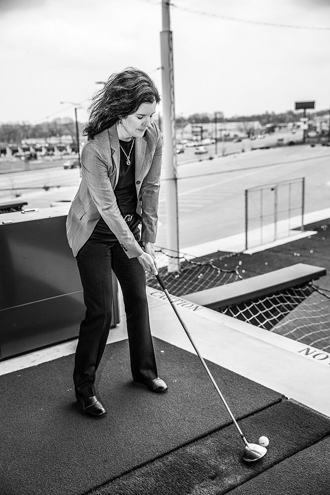 MEASURED APPROACH: At BigShots Golf, she prepares to swing.