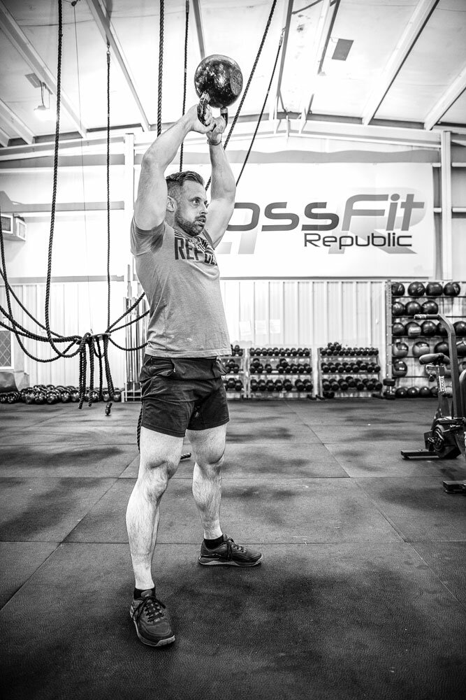 STRENGTH TRAINING: Mitchell lifts a kettle bell as on of the exercises he undertakes most days at CrossFit Republic, a business he's owned for 10 years.
