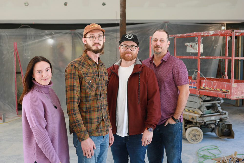 From left, Meredith Tatum, Dustin Myers, Jeremy Wells and Sheldon Pruiett stand in the future coffee and wine bar of The Ozarker Lodge.