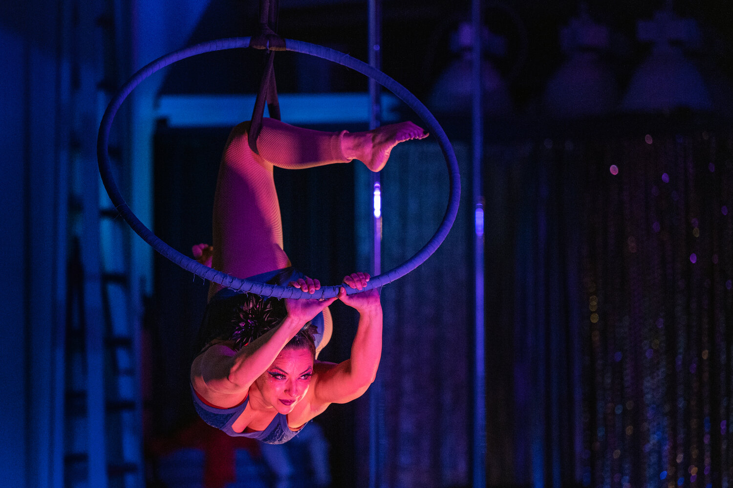 Daniela Torres, owner and instructor of Springfield Aerial Fitness, performs on the lyra during the studio's show, "Unleashed," on May 7.